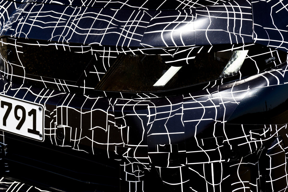 Camouflaged next-generation BMW 3 Series prototype during development testing in Miramas